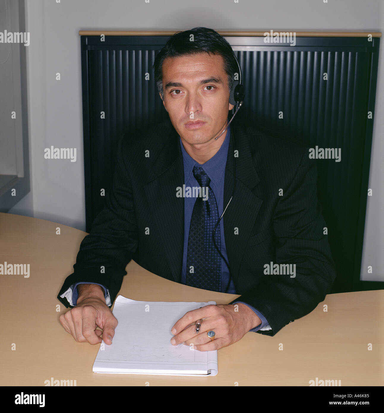 Businessman using a telephone headset Stock Photo
