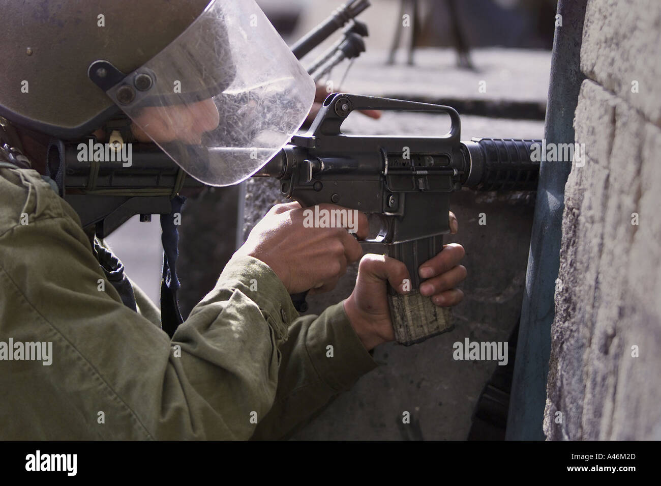 An Israeli Defence Force (IDF) soldier fires rubber bullets at
