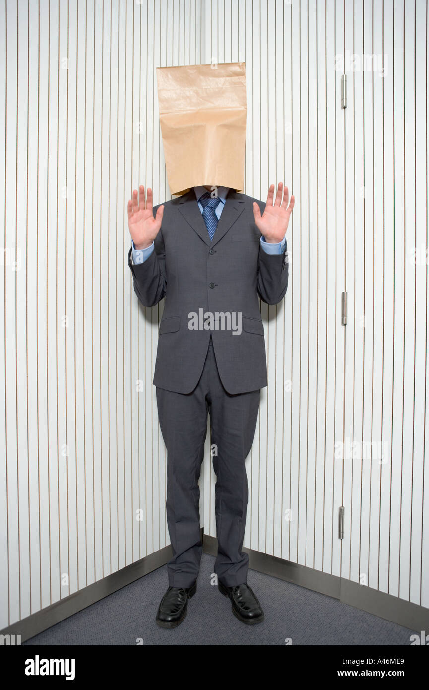 Businessman with paper bag on head Stock Photo Alamy