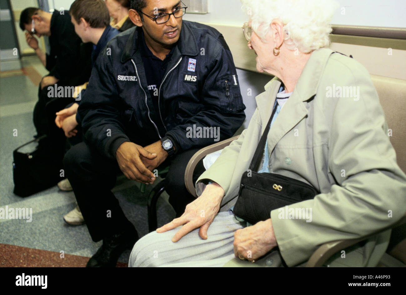 A Security Guard at King's College Hospital in London talks to an
