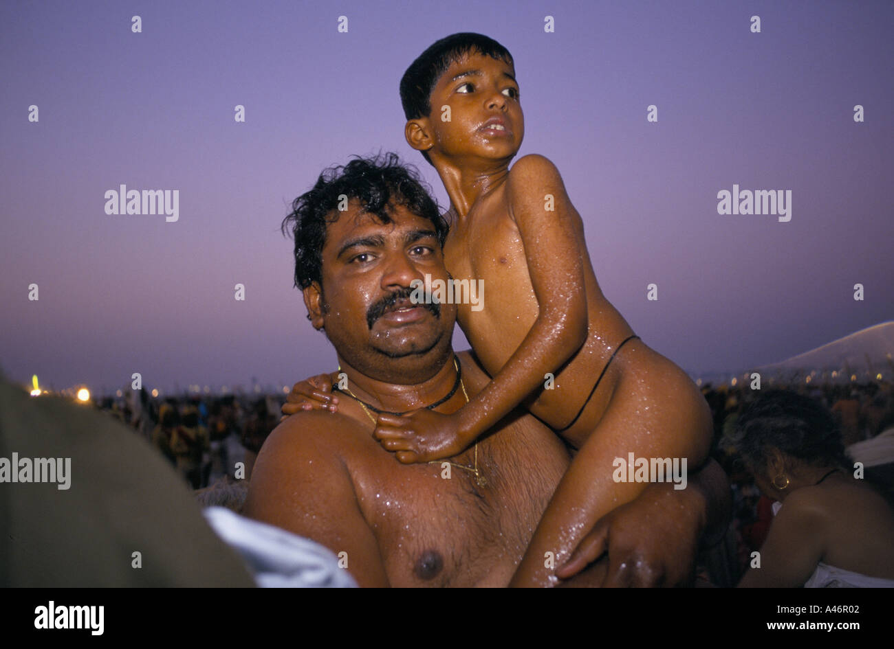 Father son after bathing kumbh hi-res stock photography and images