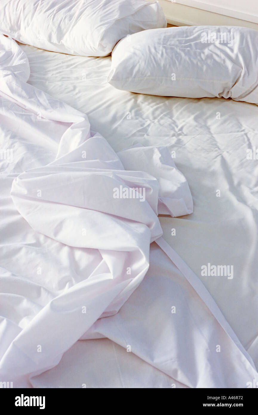 Crumpled sheets on bed Stock Photo Alamy