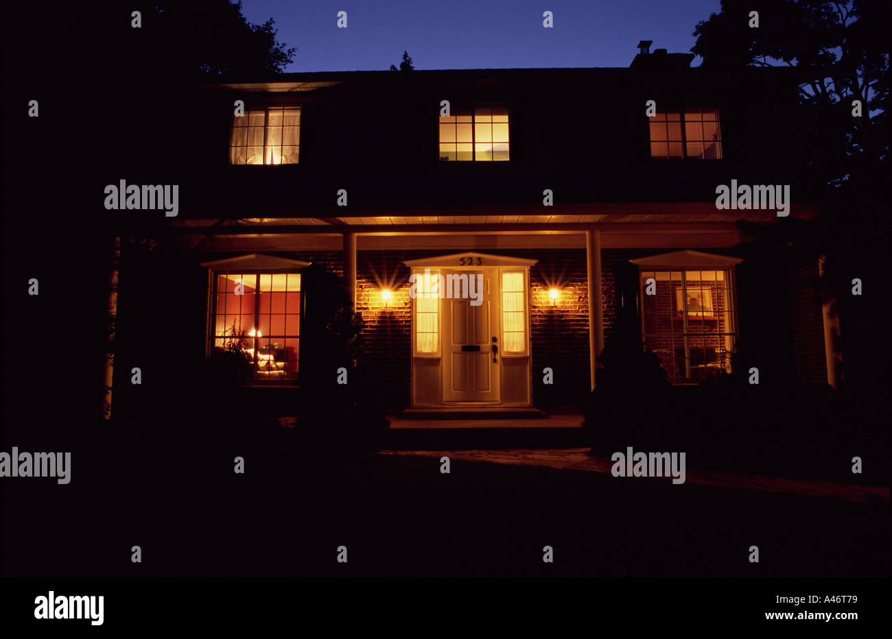 Luxury house illuminated at night Stock Photo