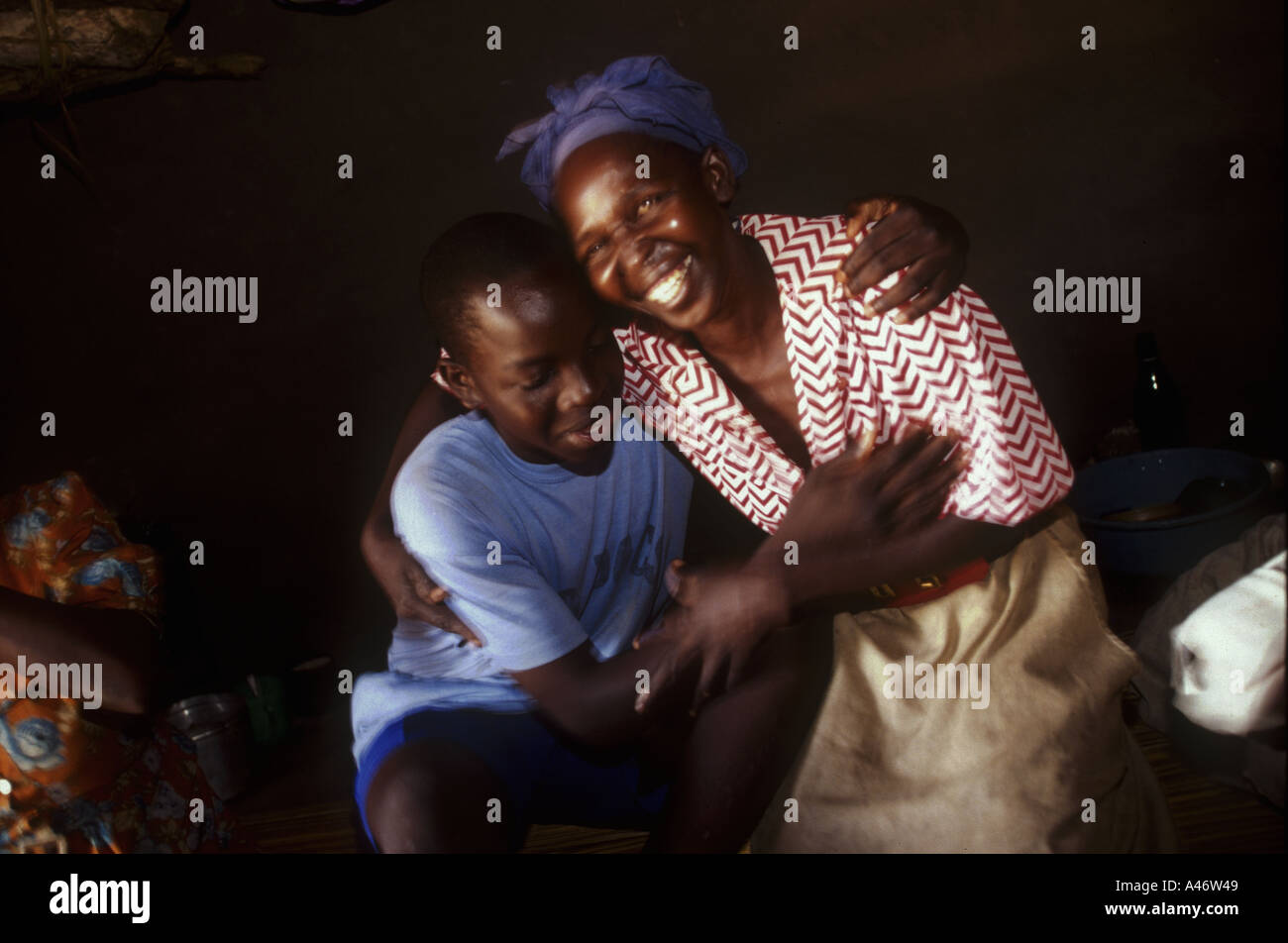 A boy abductee fighter from the Lords Resistance Army reunited with his mother and family, Gulu, Northern Uganda Stock Photo