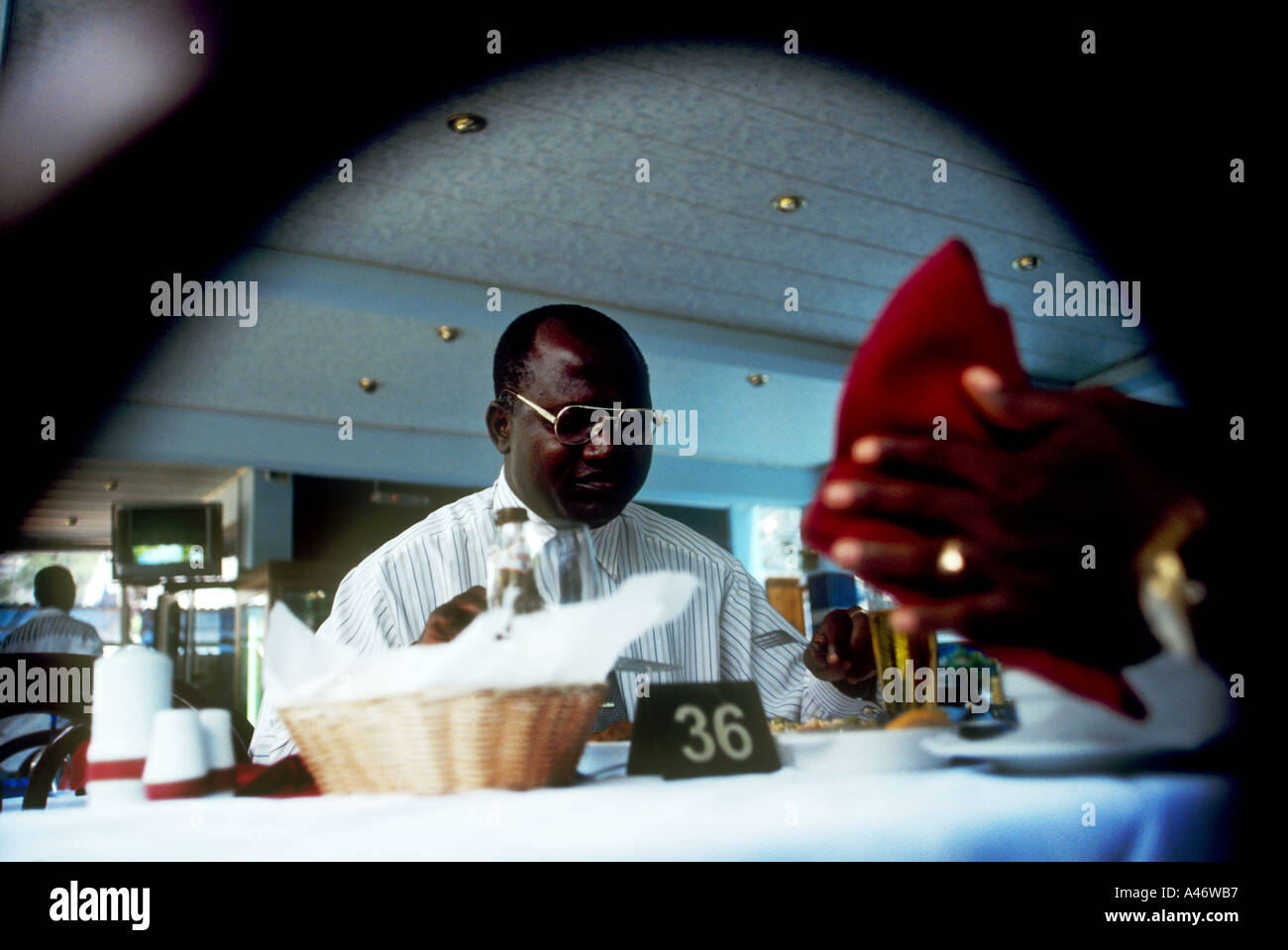 Wealthy Luandans lunch at an expensive restaurant on the Marginal, a