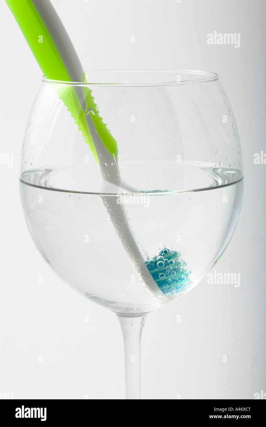 Tooth brush in a water glass Stock Photo Alamy