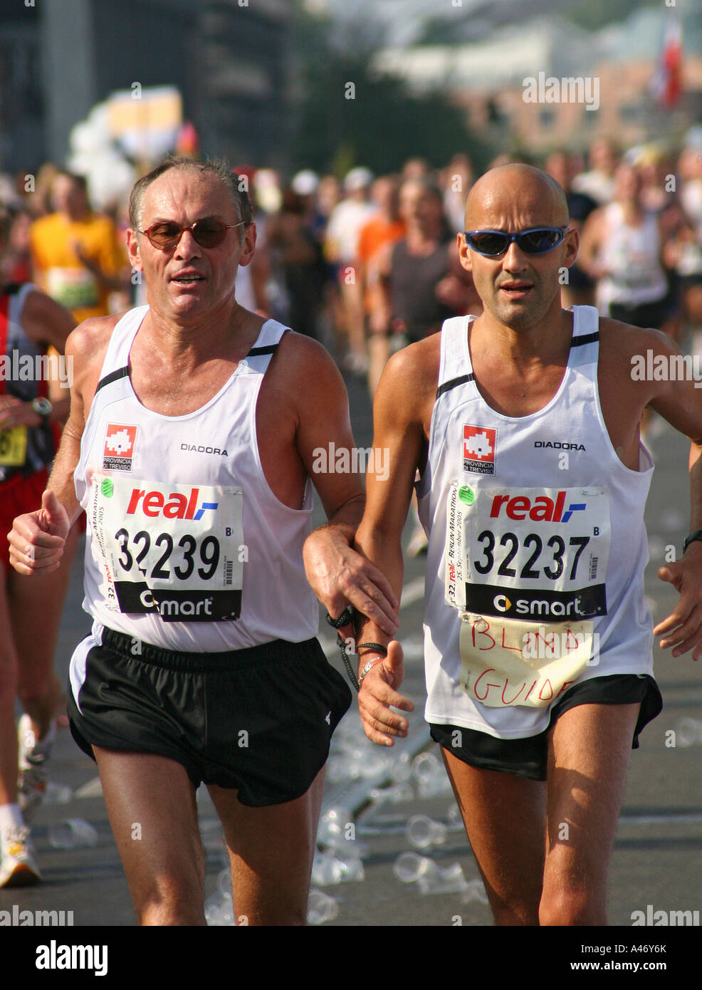 Blind runner and guide at the Berlin Marathon, Berlin, Germany Stock Photo