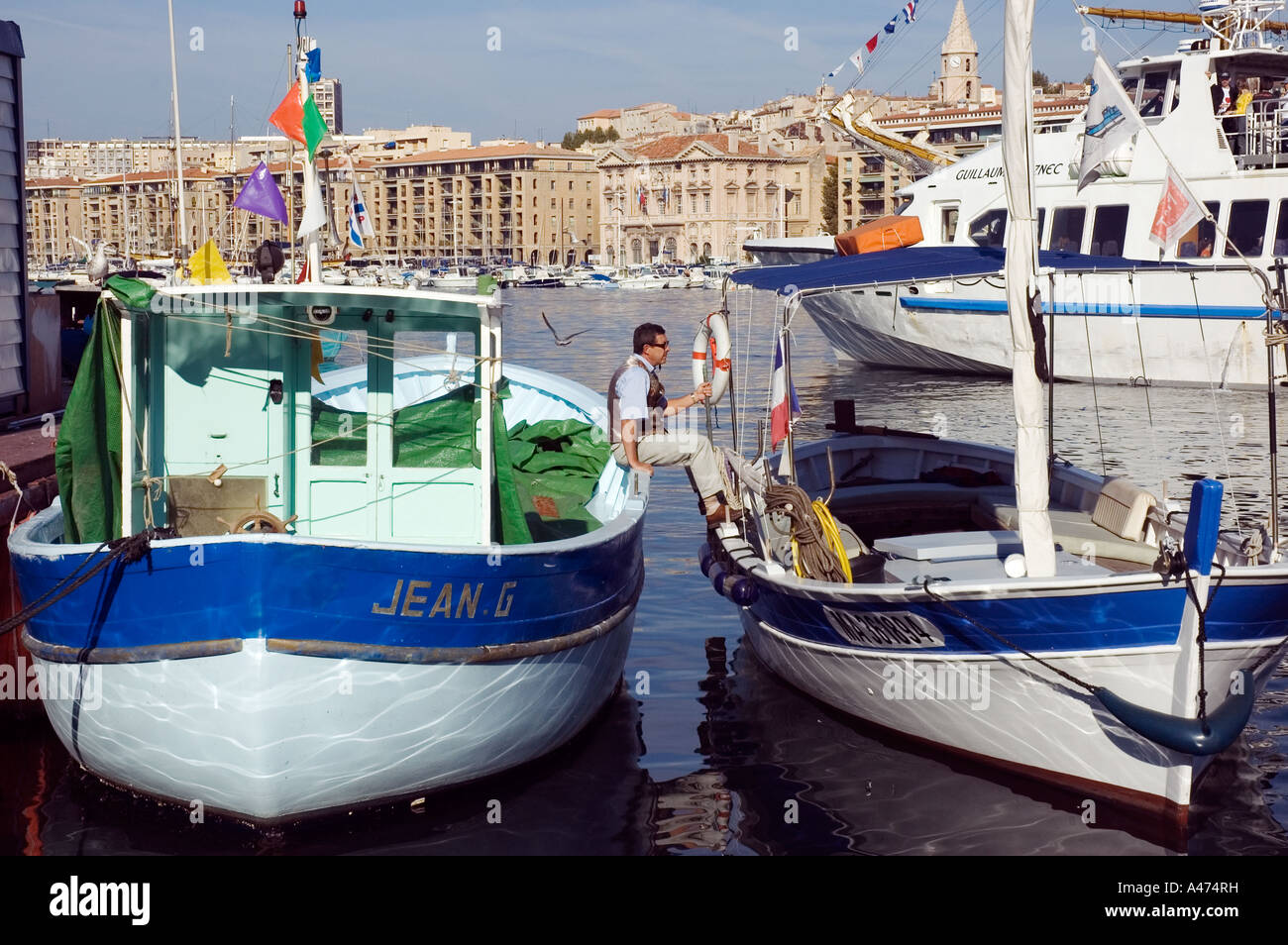 Man sitting on a boat hi-res stock photography and images - Alamy