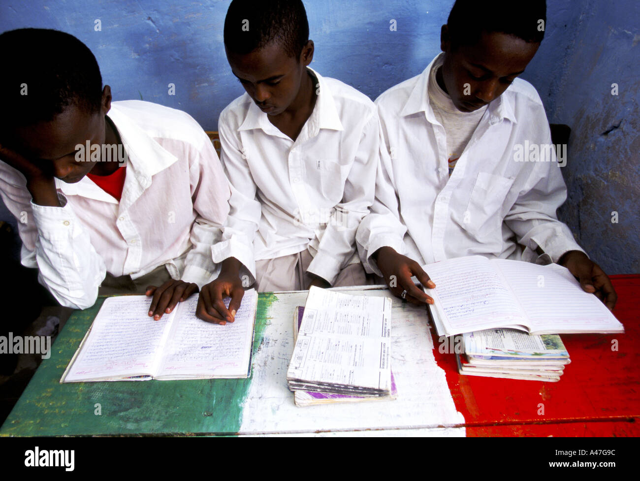 boys study in a secondary school on a desk painted in Somaliland national colours Hargeisa capital of Somaliland Stock Photo