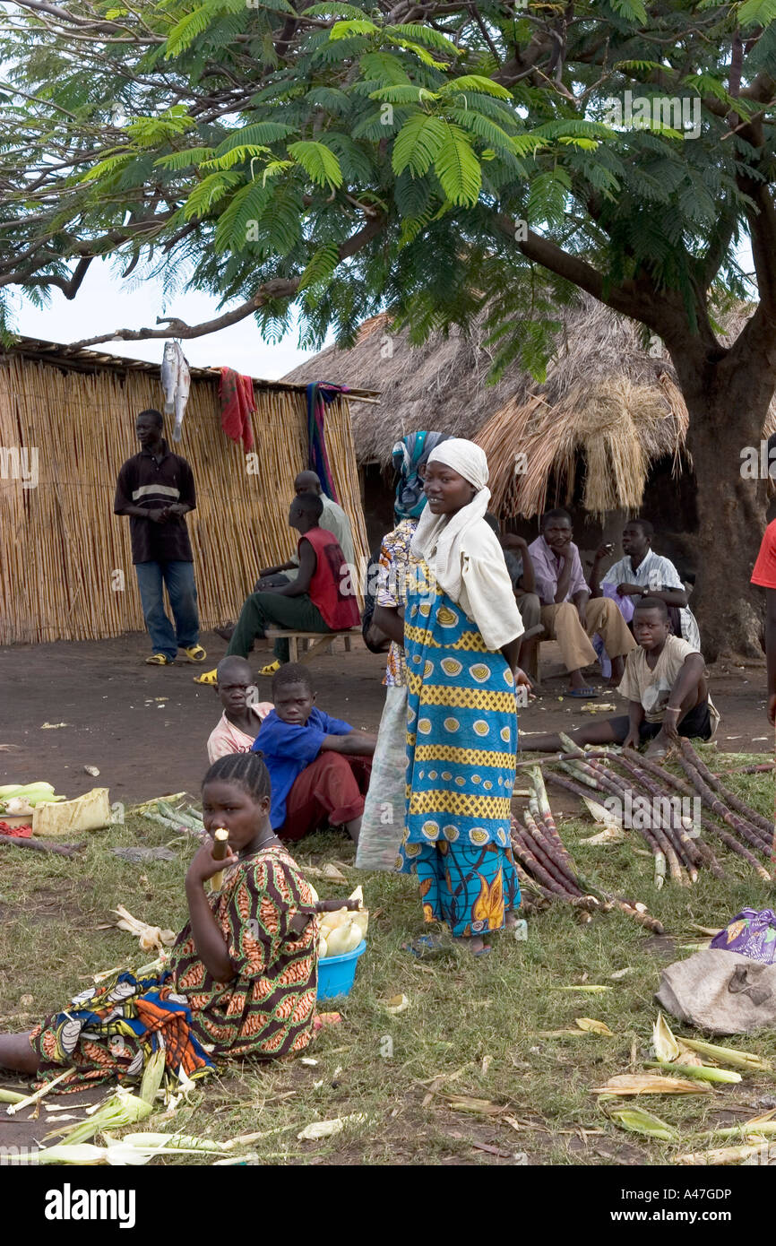 Local people buying and selling in market of remote fishing village, Lake Albert, Northern Uganda, East Africa Stock Photo