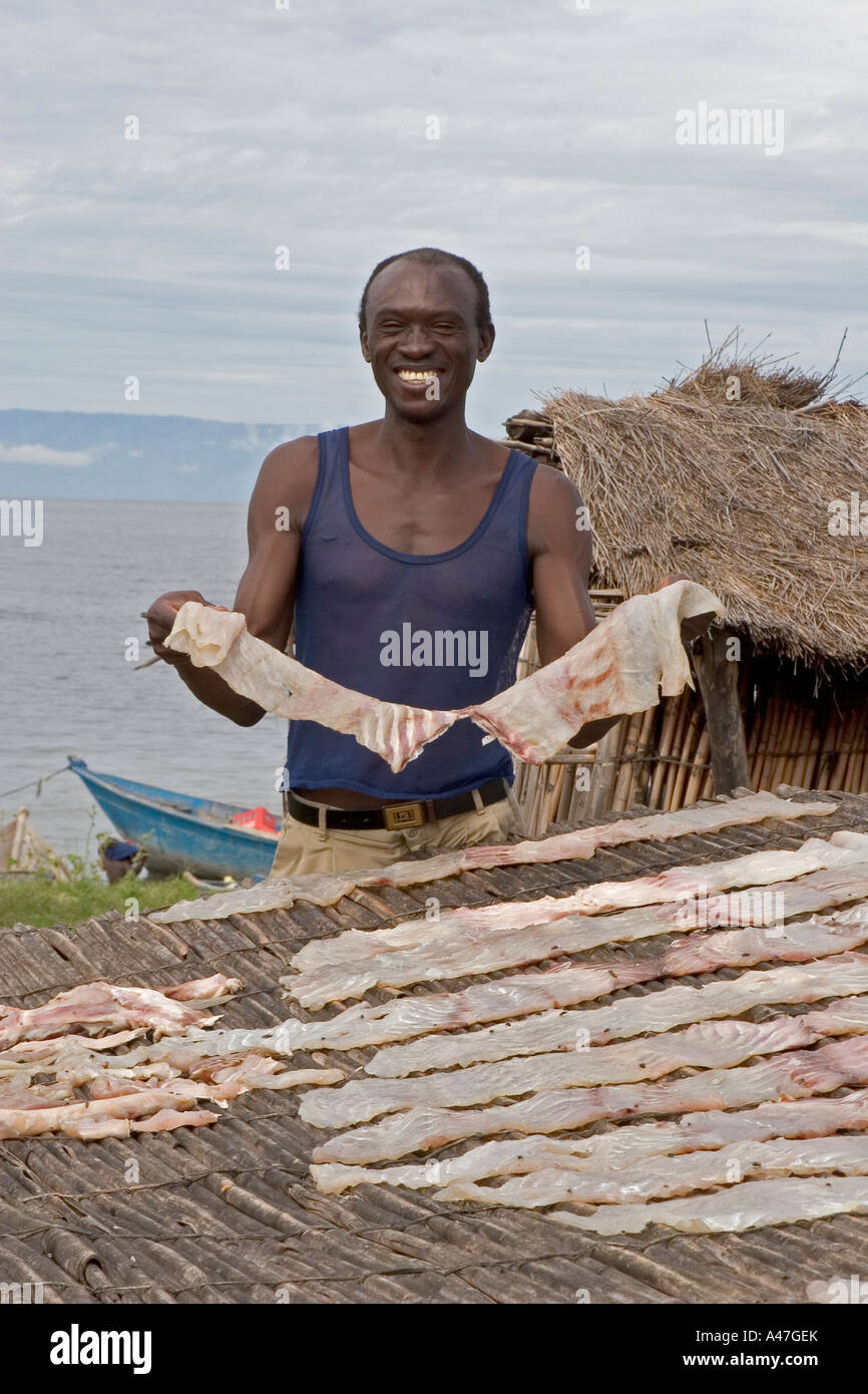 Fisherman selling locally caught fish in market of remote fishing
