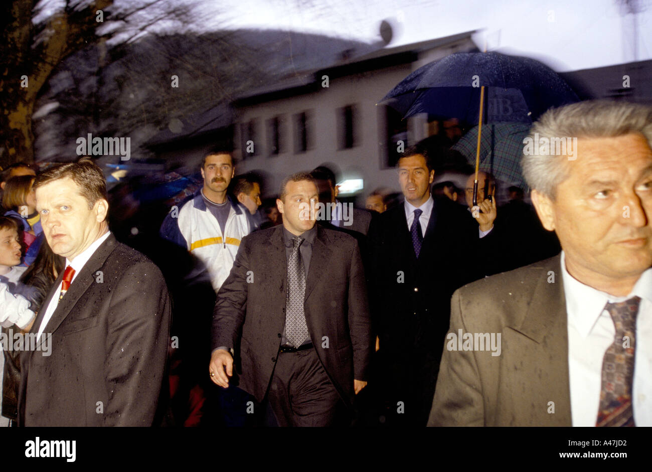 president milo djukanovic arriving at a public meeting with security men and bodyguards bielo polje montenegro Stock Photo