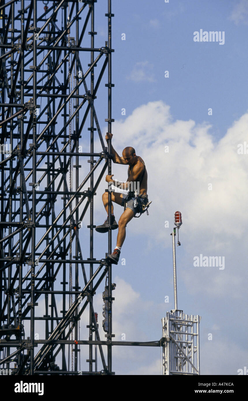 u2 on tour june 1993 pop group u2 on tour rigger climbing stage tower Stock Photo