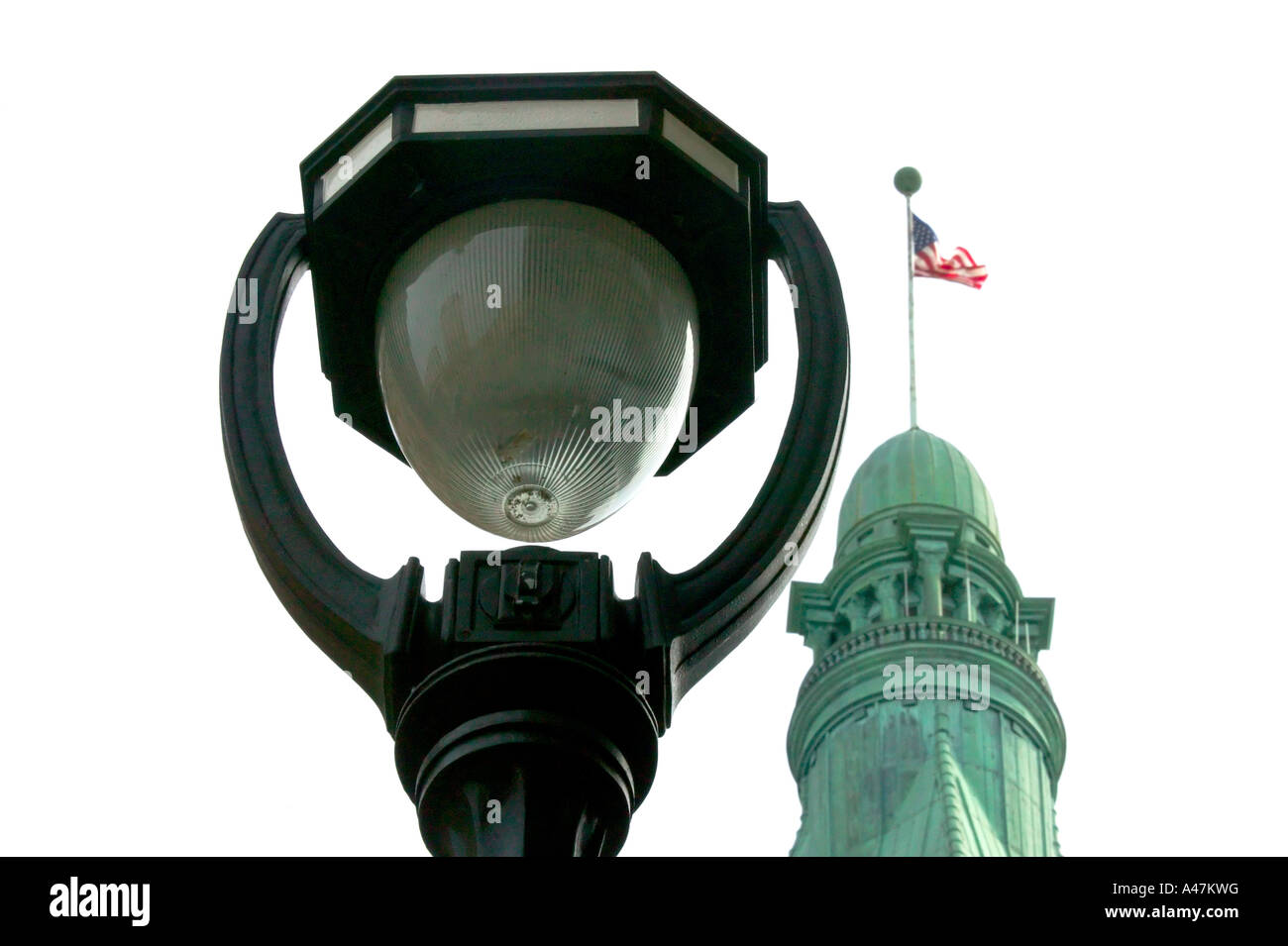 Old fashioned streetlamp and roof of City Hall Milwaukee Wisconsin USA Stock Photo