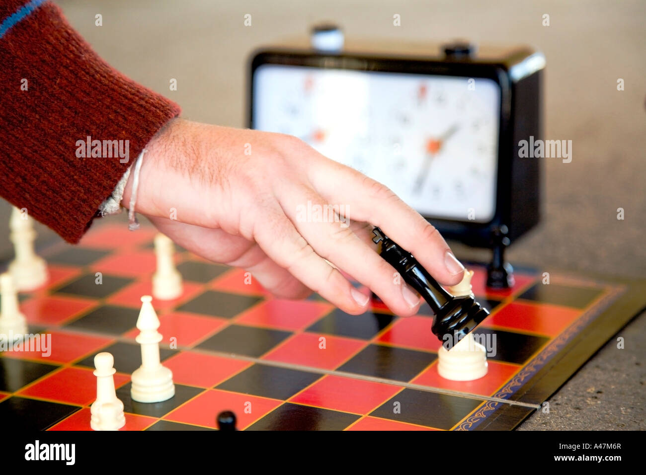 Hand of teenage boy playing speed chess Stock Photo