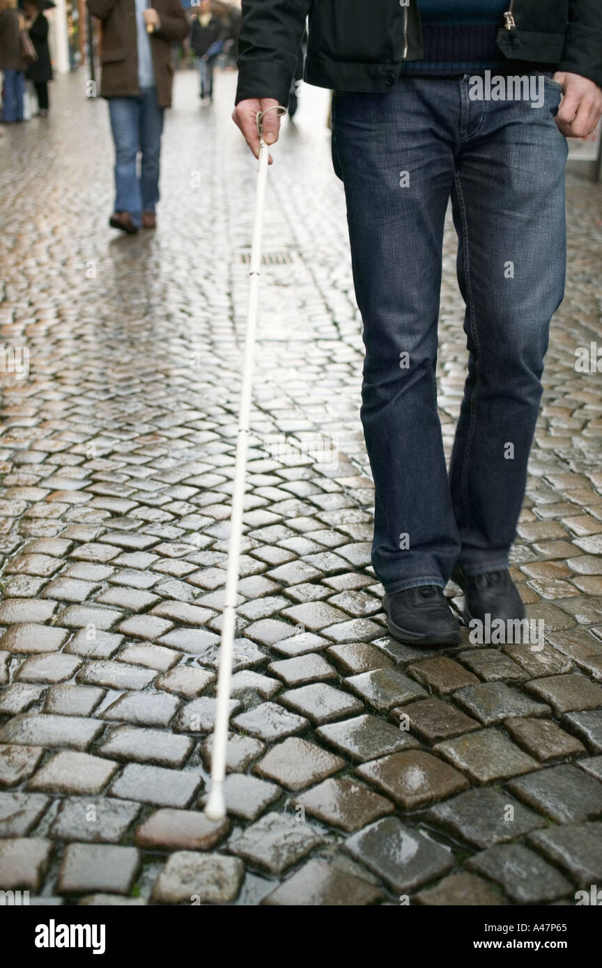 Blind man using a cane Stock Photo Alamy