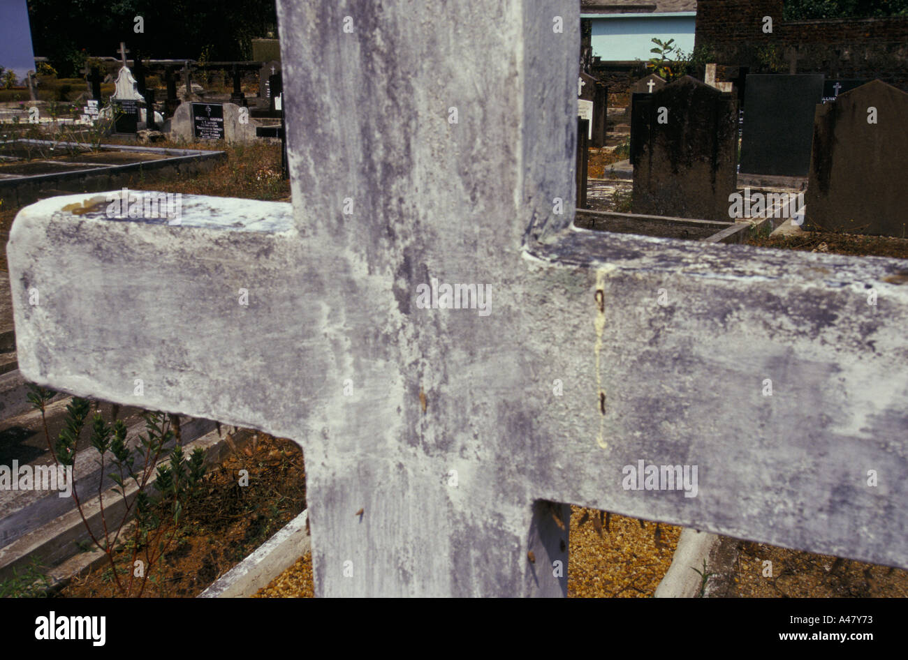 A stone cross in a Christian graveyard in Ayemenam in Kerala India Stock Photo
