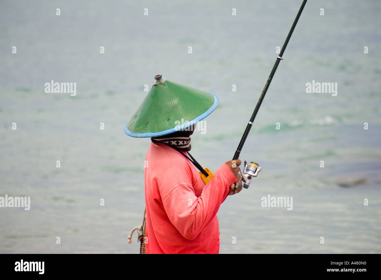 Balinese fishing on Tuban beach Bali Indonesia Stock Photo