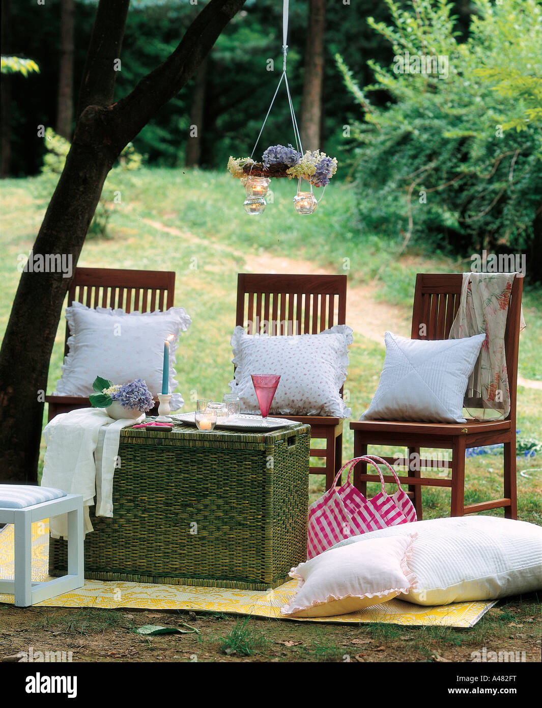 Chairs and a table in the garden Stock Photo - Alamy