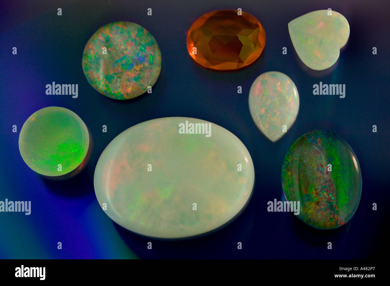 Selection of gemstones on a blue background Stock Photo