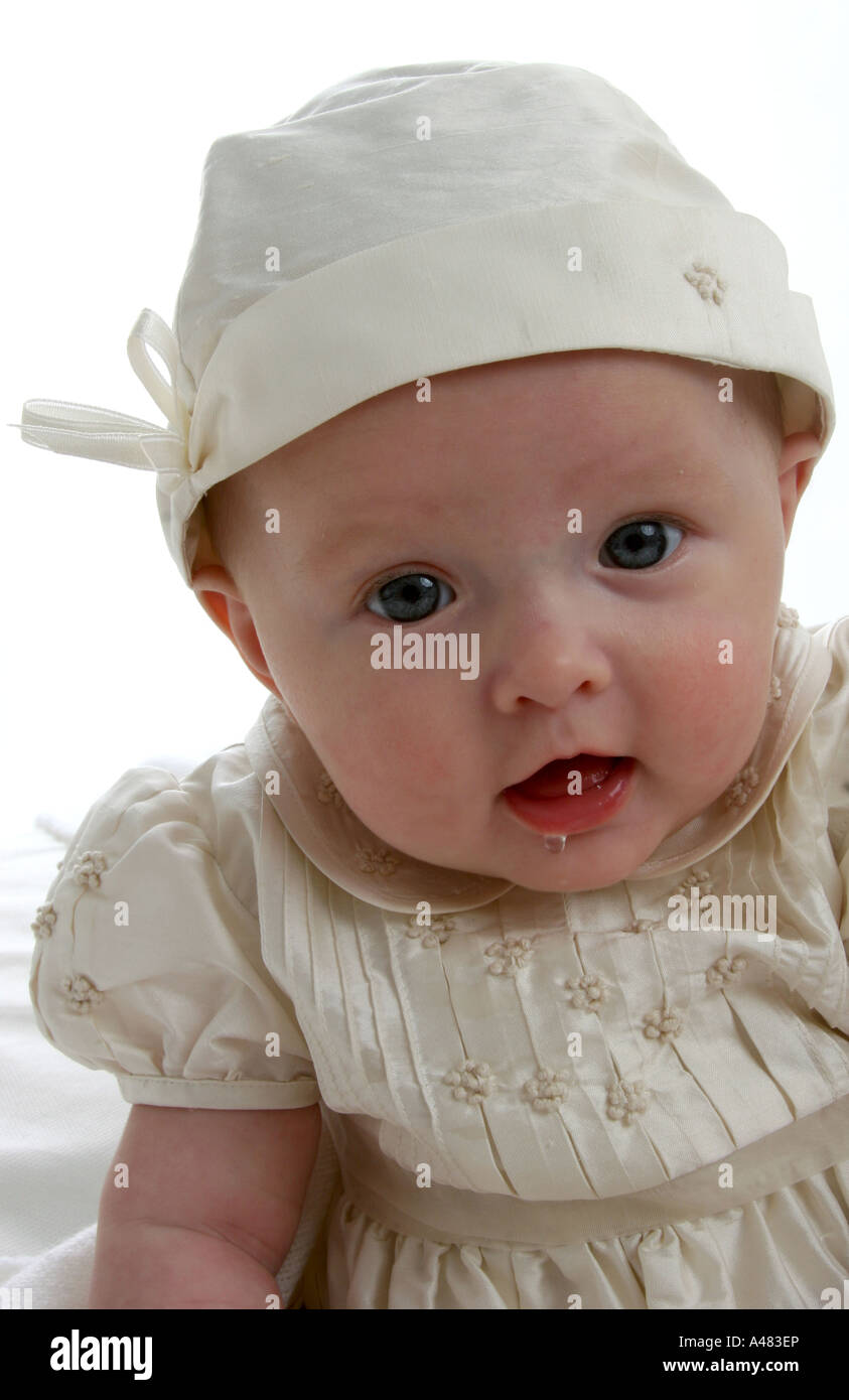 Baby girl dressed in her christening gown Stock Photo Alamy