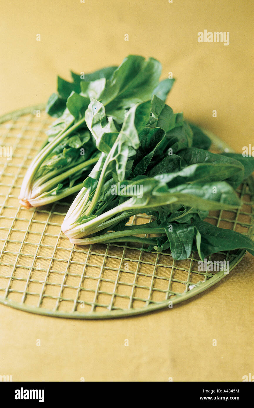 High angle view of spinach leaves on a metal rack Stock Photo - Alamy