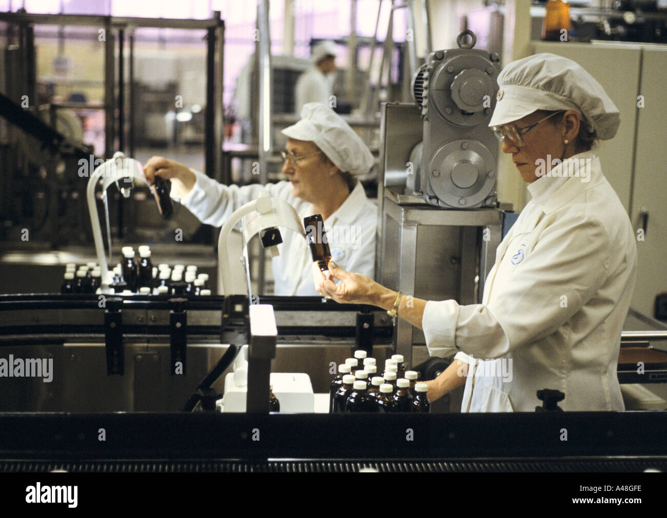 Checking bottles of eyewash . Boots pharmaceutical factory Nottingham