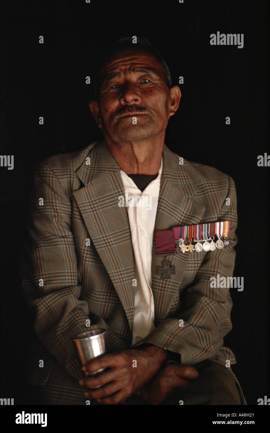 A retired Gurka wearing the medals he won including a Victoria Cross for fighting the japanese Stock Photo