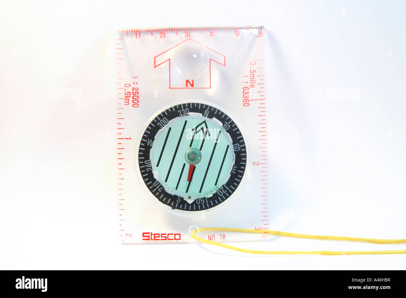 Compass resting on plain background Stock Photo - Alamy