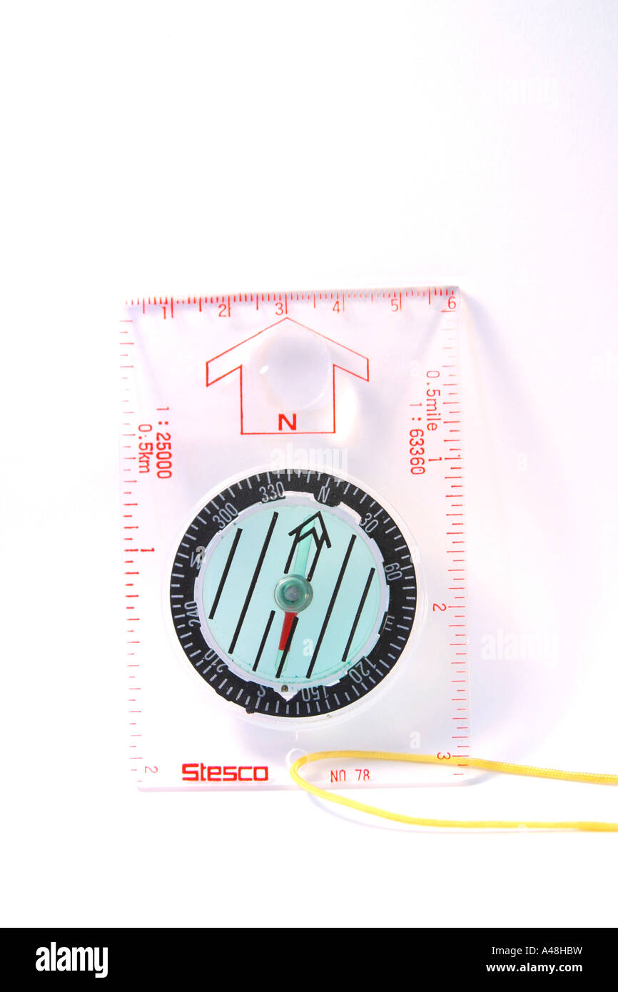 Compass resting on plain background Stock Photo - Alamy