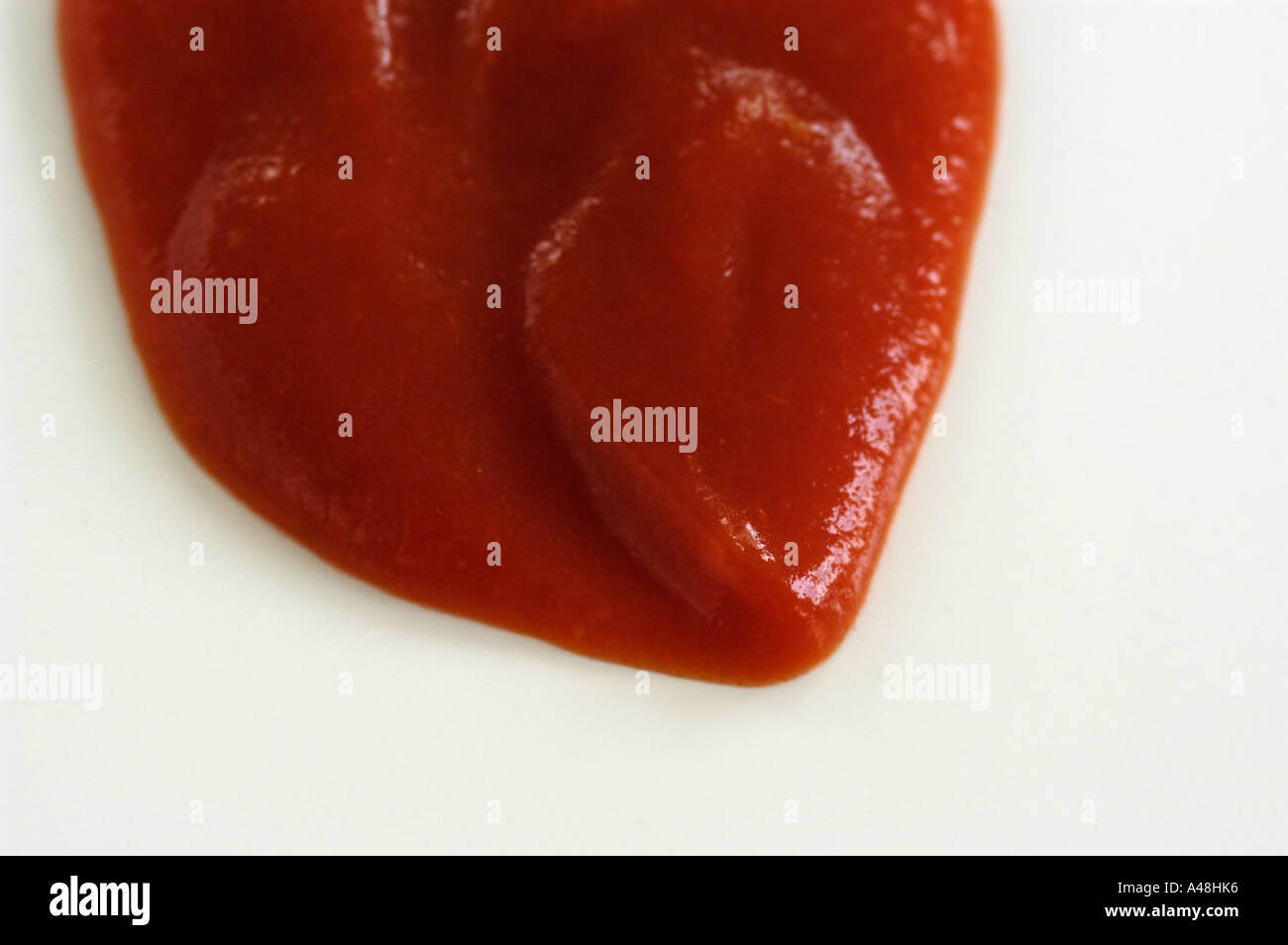 Dollop of tomato ketchup on white background Stock Photo