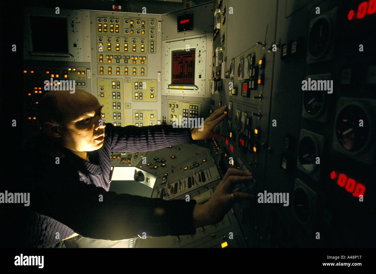 faslane naval base officer at control panel of trident nuclear armed submarine Stock Photo