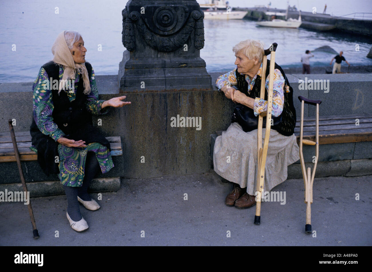 two old women chatting on the seafront in yalta crimea  ukraine Stock Photo