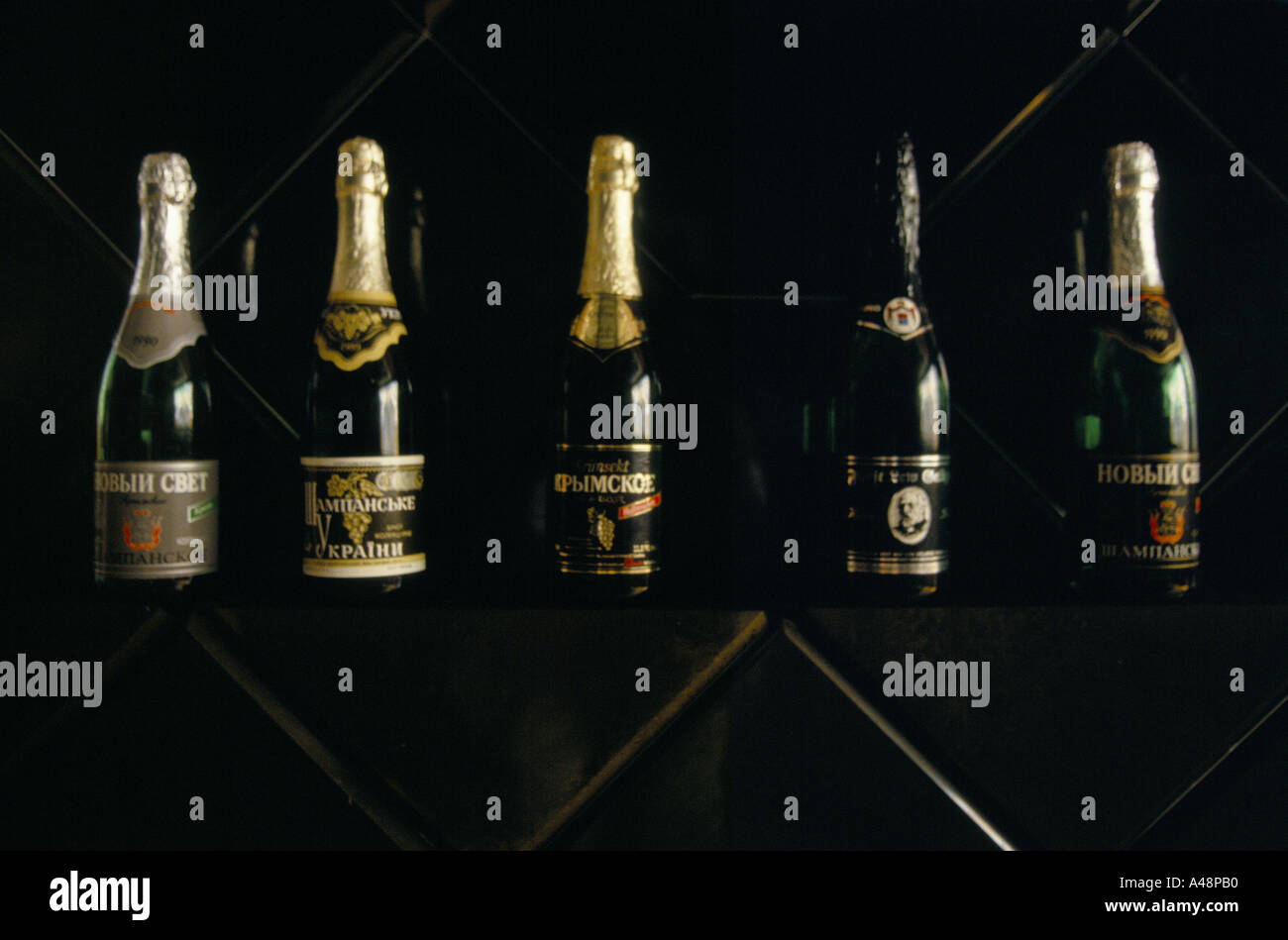 Bottles of various varieties of sparkling wine at a bottling plant. Sudak Crimea Ukraine Stock Photo