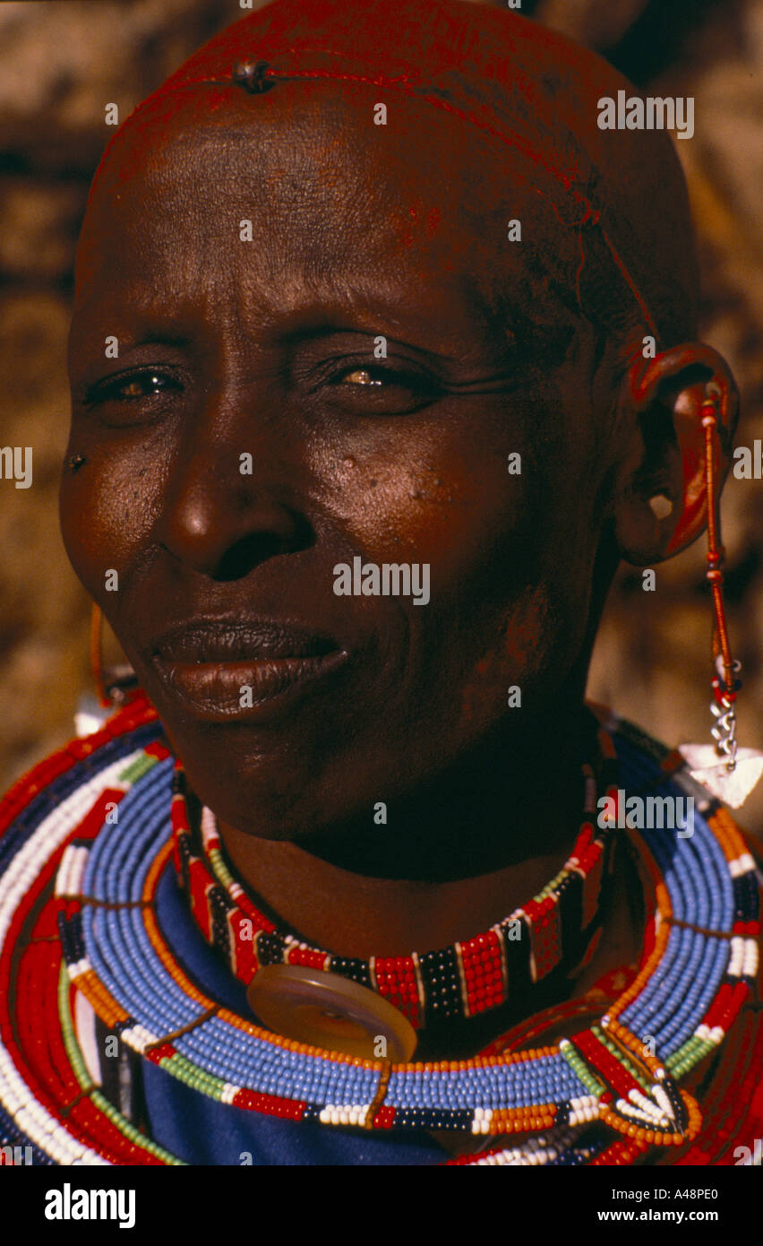 a masai woman wearing traditional bead necklace and earings with red ochre dyed hair.Ngong Hills Nairobi Kenya Stock Photo