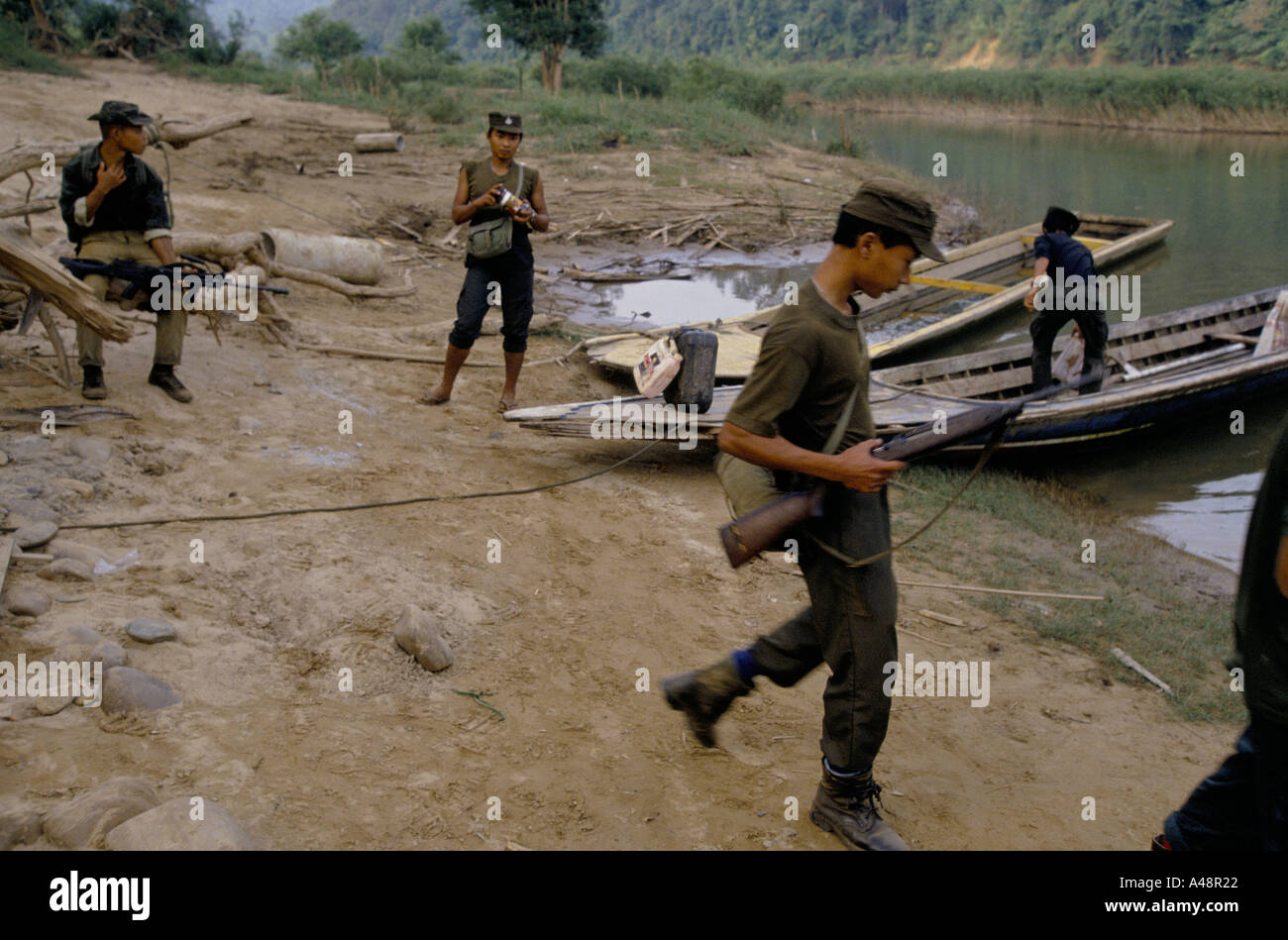 Karen rebels mounting a river patrol on the moei river .manerplaw Stock