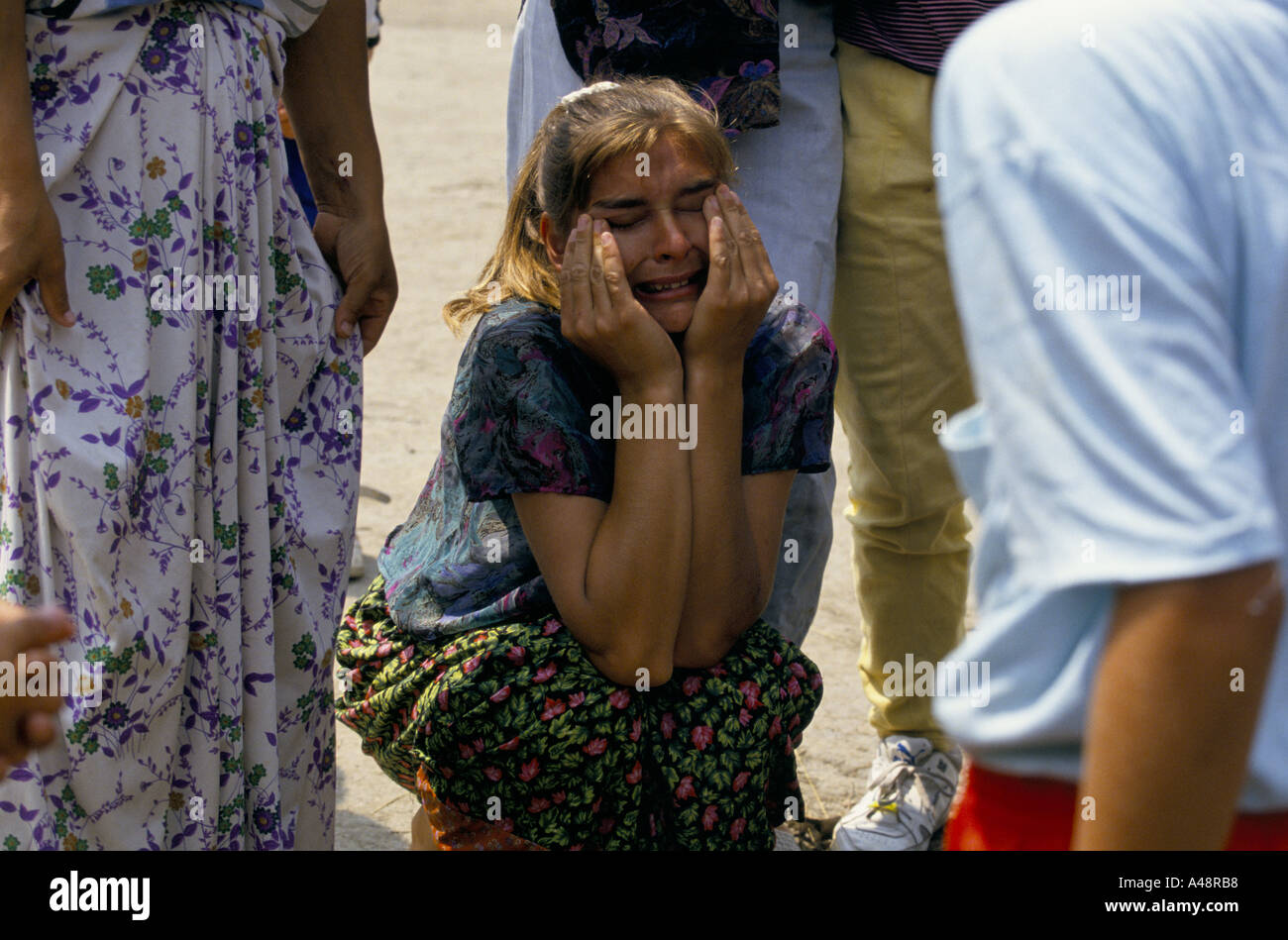 A grief stricken woman who escaped from srebrenica is told that her husband ihas been killed by serb soldiers Stock Photo