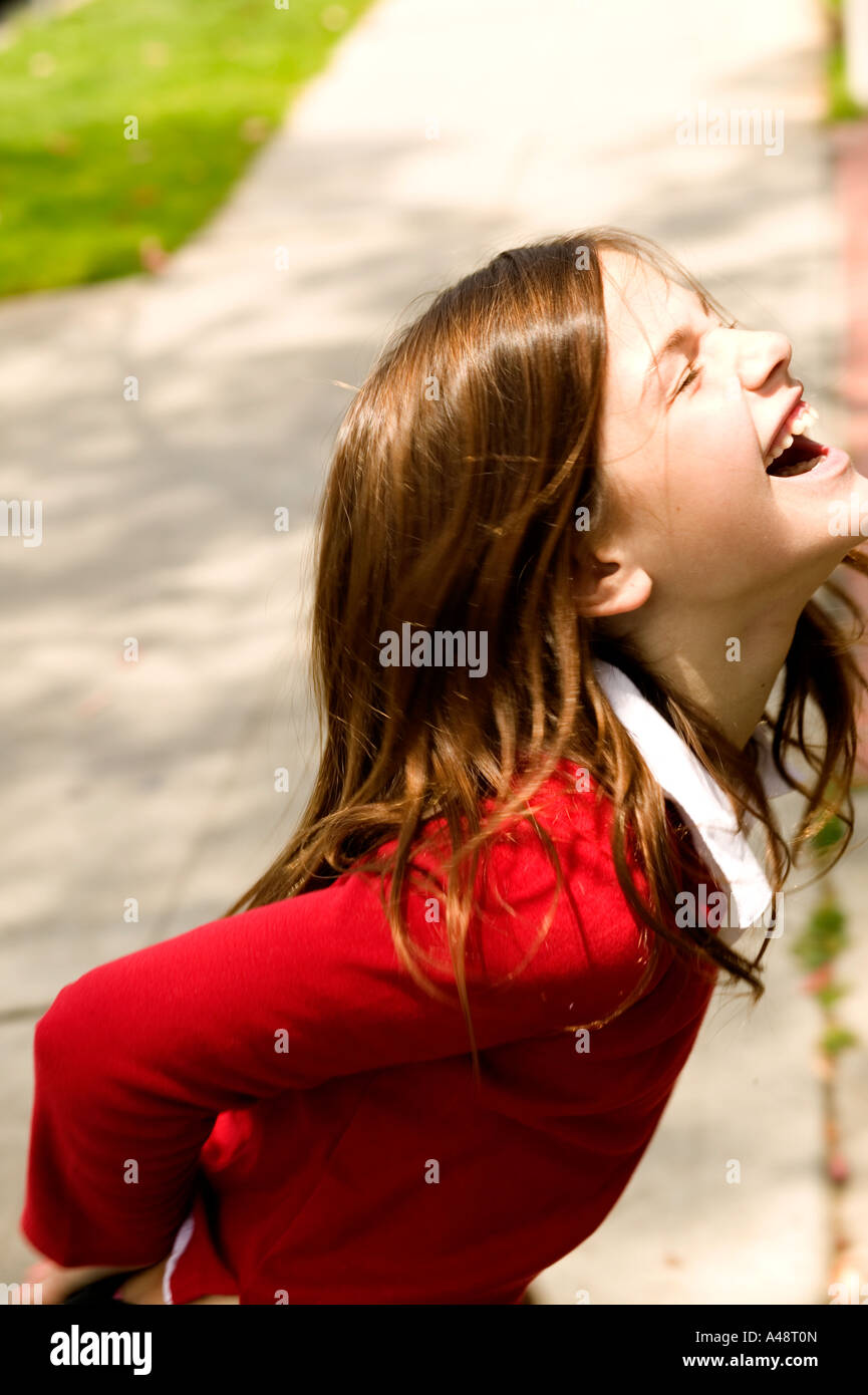 Girl smiling closed eyes hi-res stock photography and images - Alamy