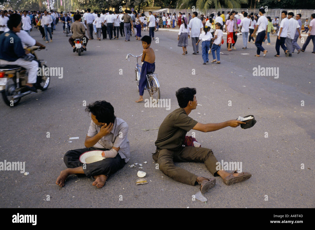 Phnom penh street scence with street beggars Stock Photo