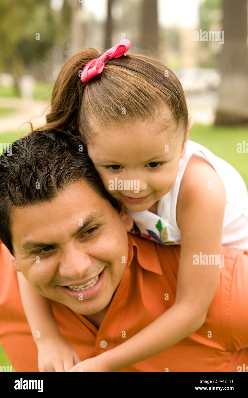 Father piggybacking his daughter Stock Photo
