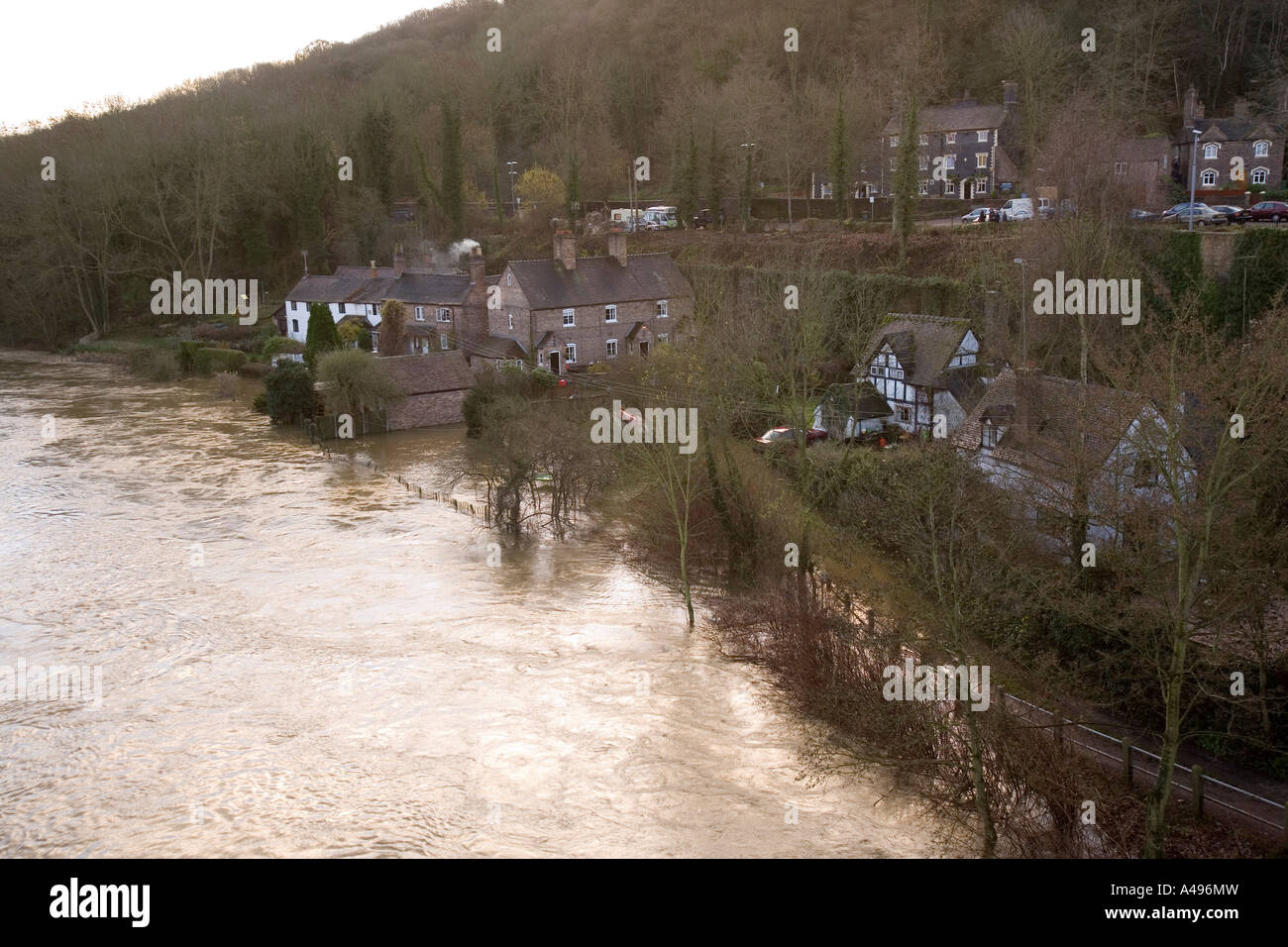 UK Shropshire Ironbridge flooding River Severn threatening riverside houses having burst its banks Stock Photo