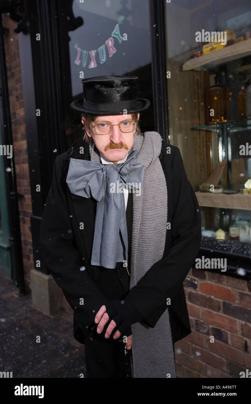 UK Shropshire Ironbridge Blists Hill Victorian Town Actor in character of Ebenezer Scrooge at Christmas Stock Photo