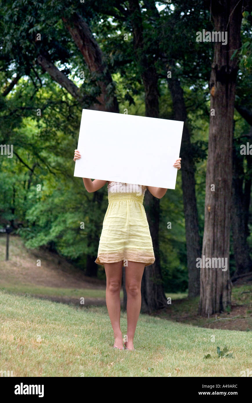 Woman holding blank sign Stock Photo Alamy