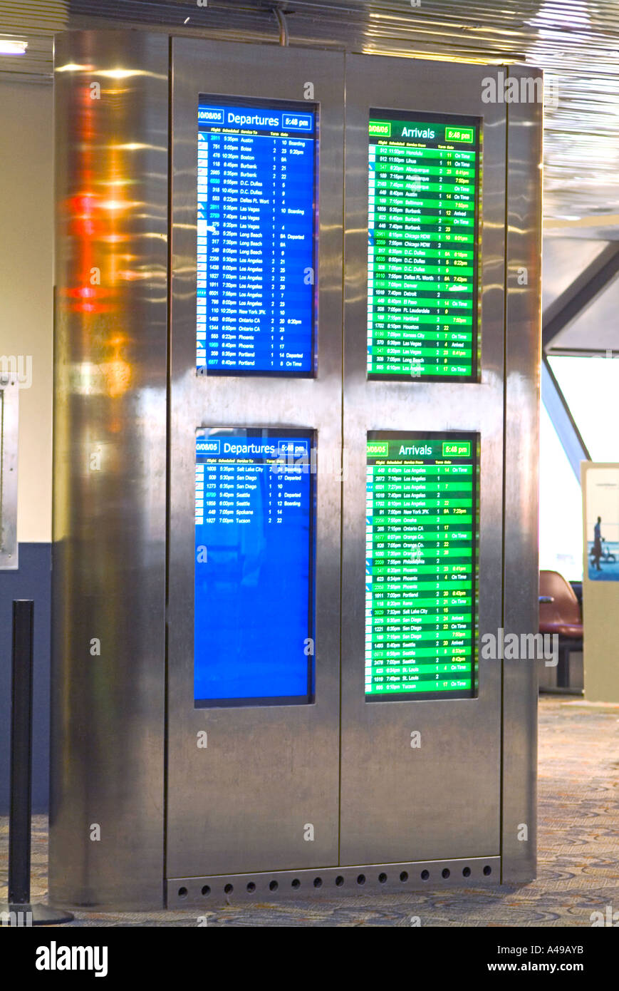 Flat screen departure monitors at airport Stock Photo
