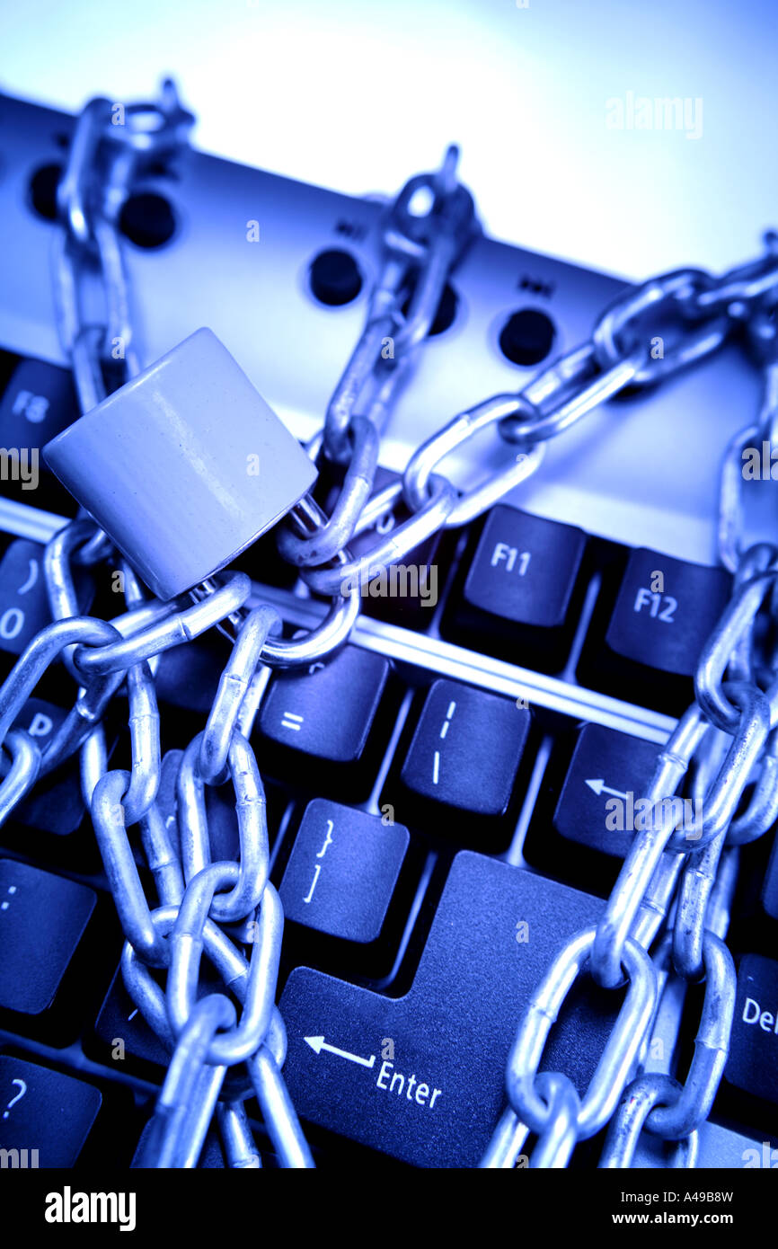 Padlock and chain around computer keyboard Stock Photo - Alamy