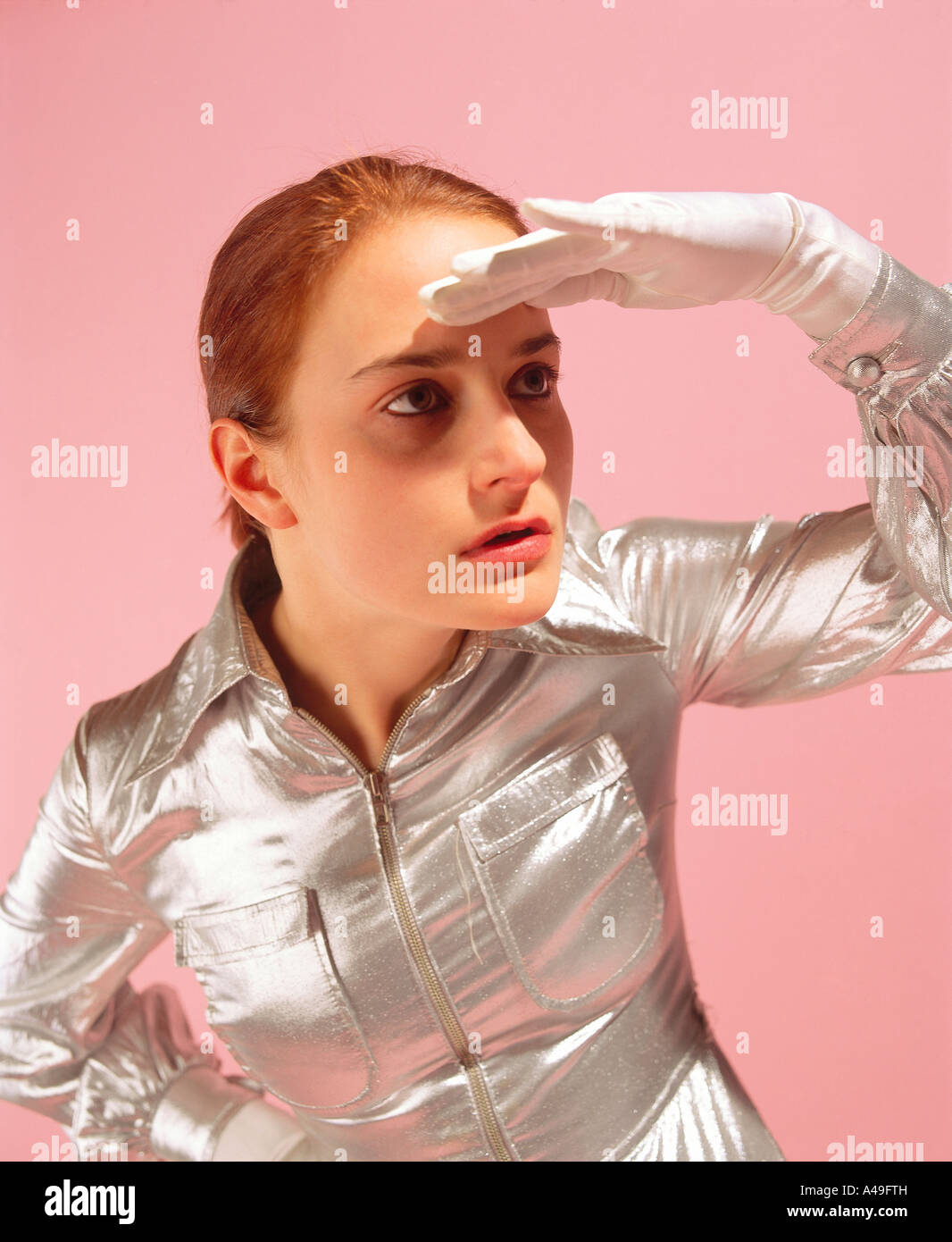 Young woman watching out for something Stock Photo
