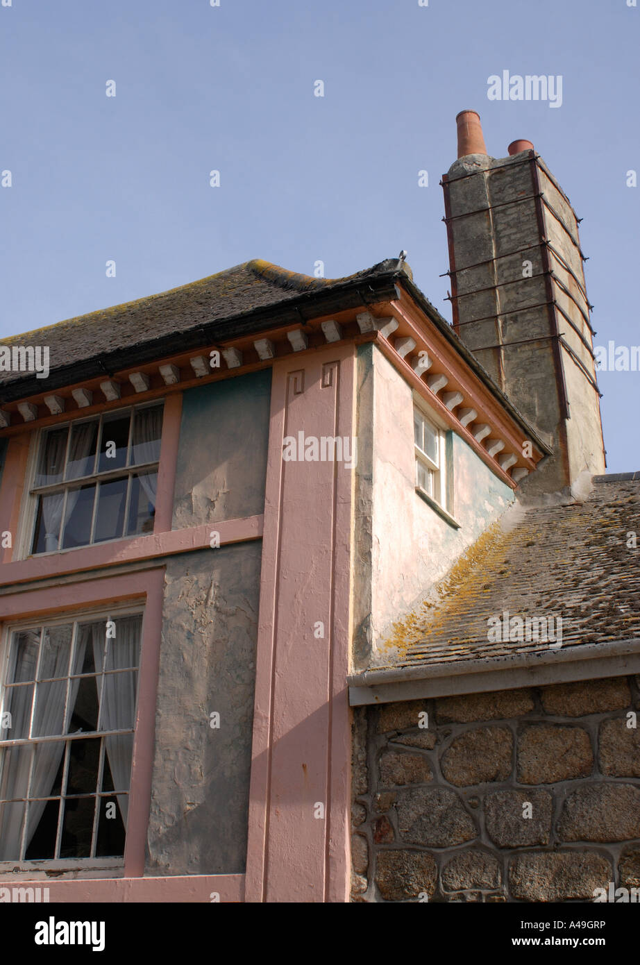 The ancient brick chimney of the Old Custom House is held together with iron straps Stock Photo