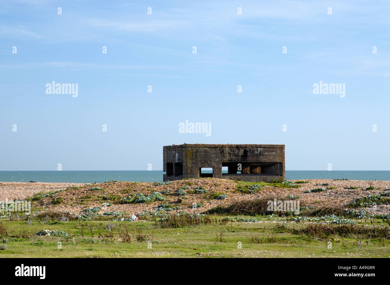 A Second World War concrete gun emplacement looks out over the English Channel Stock Photo