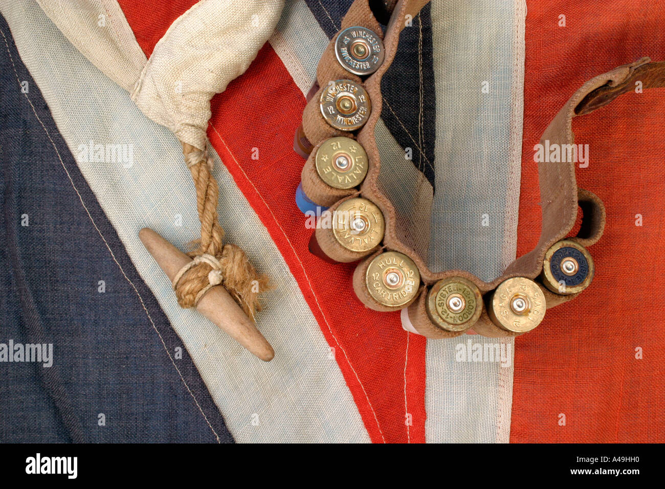 union jack british flag with cartridge belt and ammunition shotgun cartridges Stock Photo