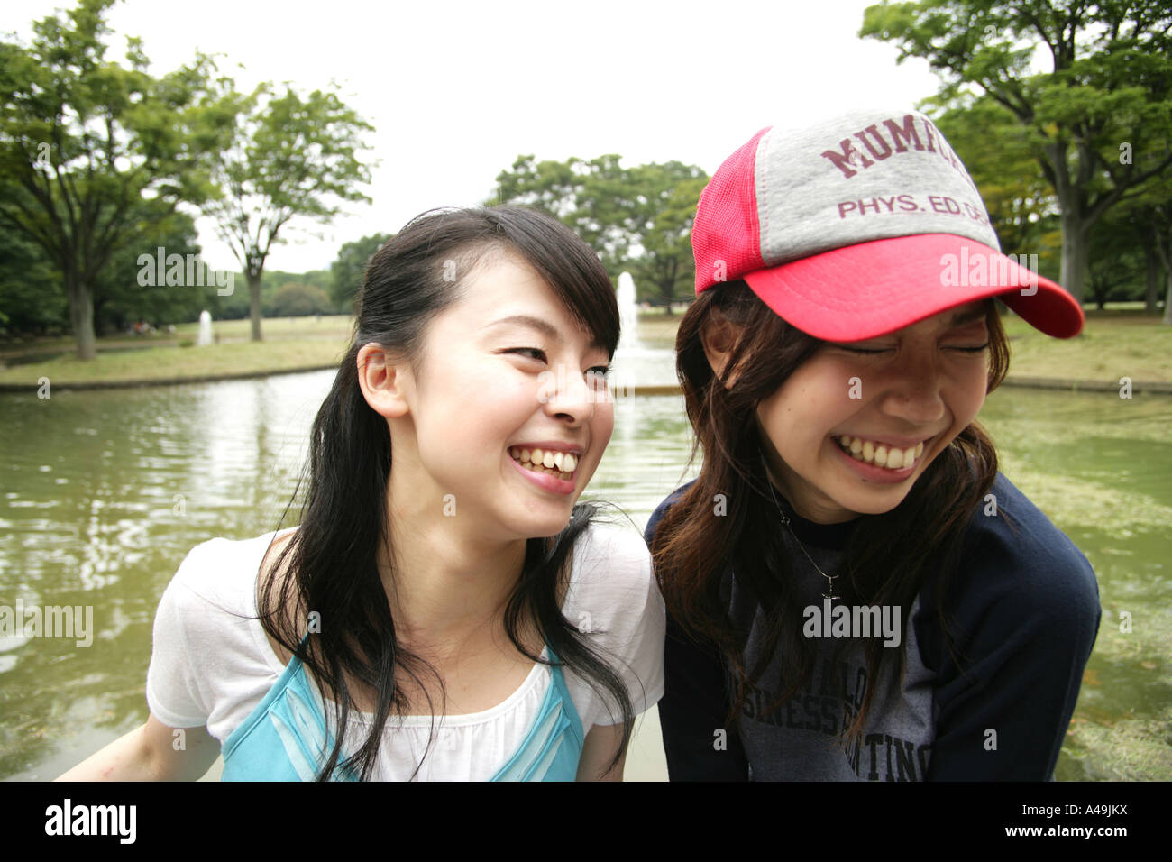 Close up of two young women smiling Stock Photo - Alamy